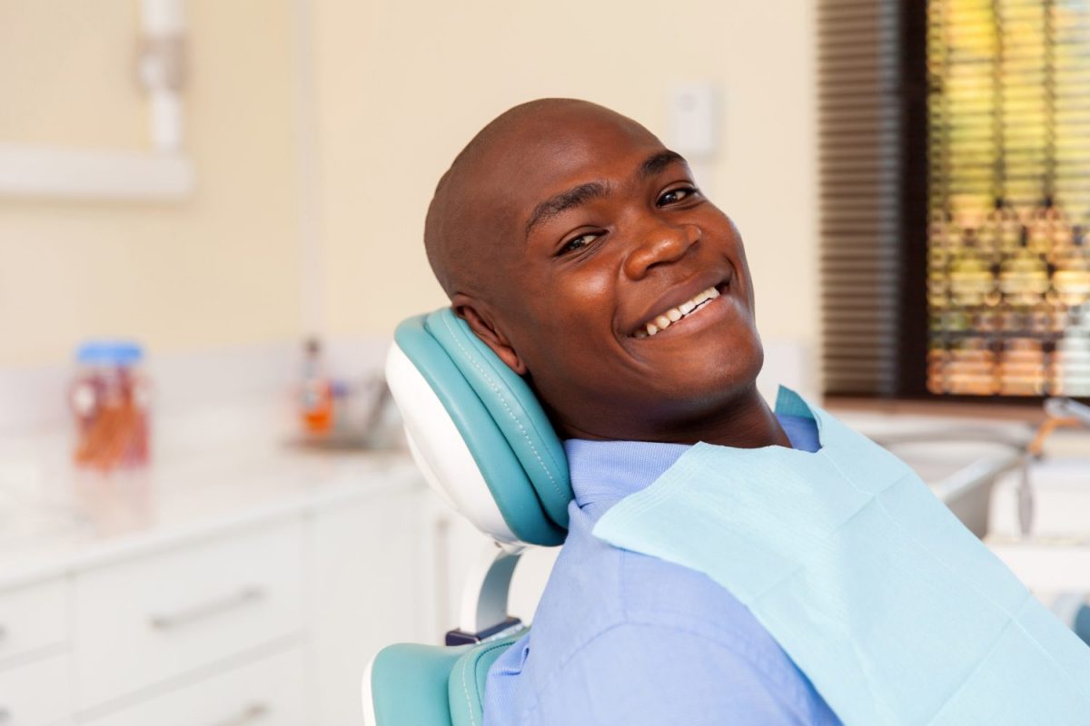 bigstock-african-man-visiting-dentist-f-94140173-1-1200x800.jpg